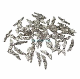 Kovová korálka krídelko 12x3 mm, strieborná, 50 ks